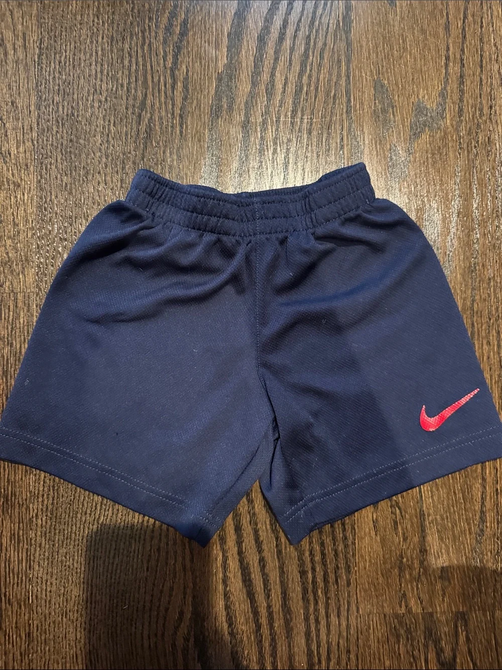 Nike Navy Kids Athletic Shorts with Red Swoosh
